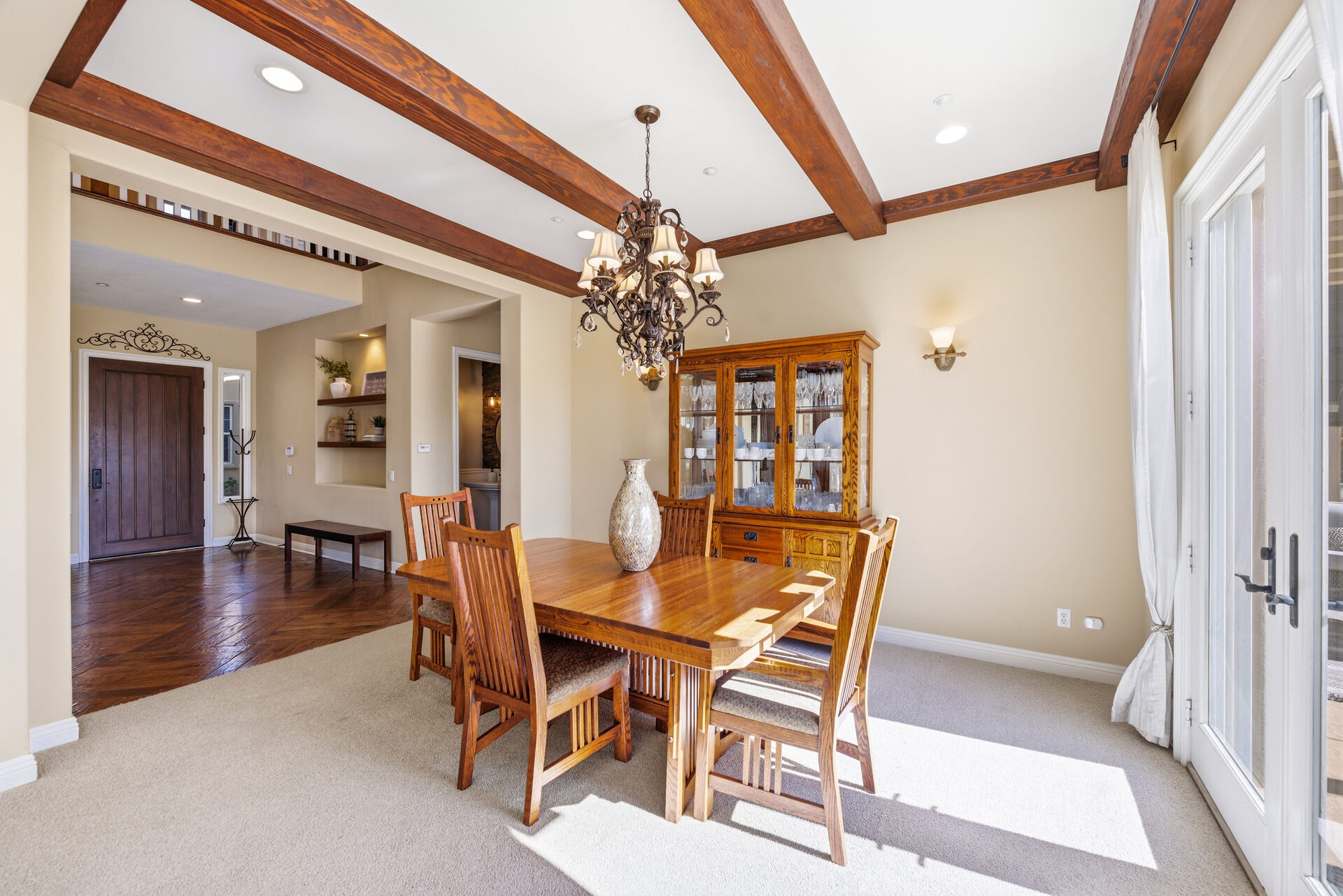 Formal dining room with wood beam ceiling