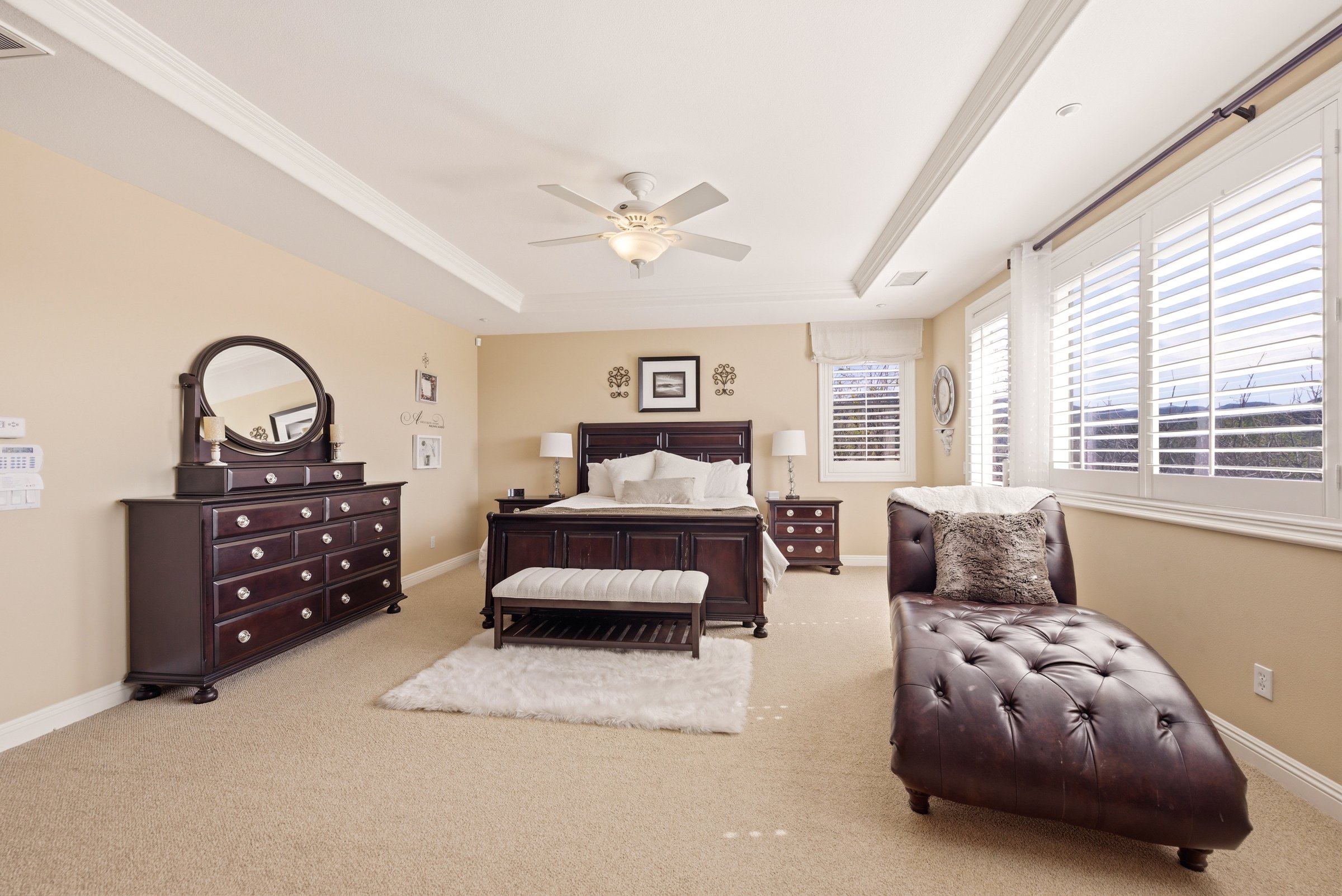 Primary suite balcony with hillside views