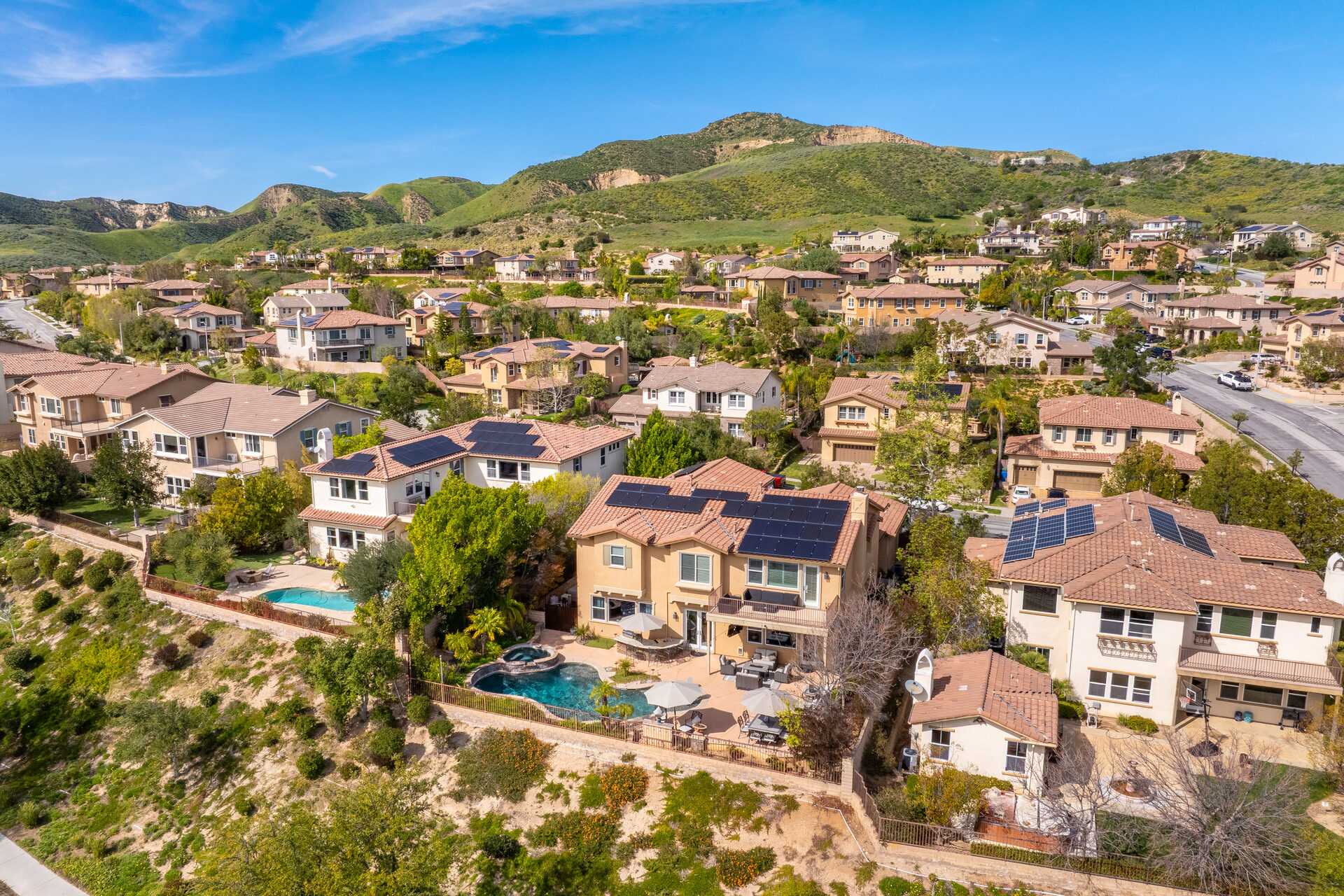 Wide aerial view showing the surrounding hills and mountains