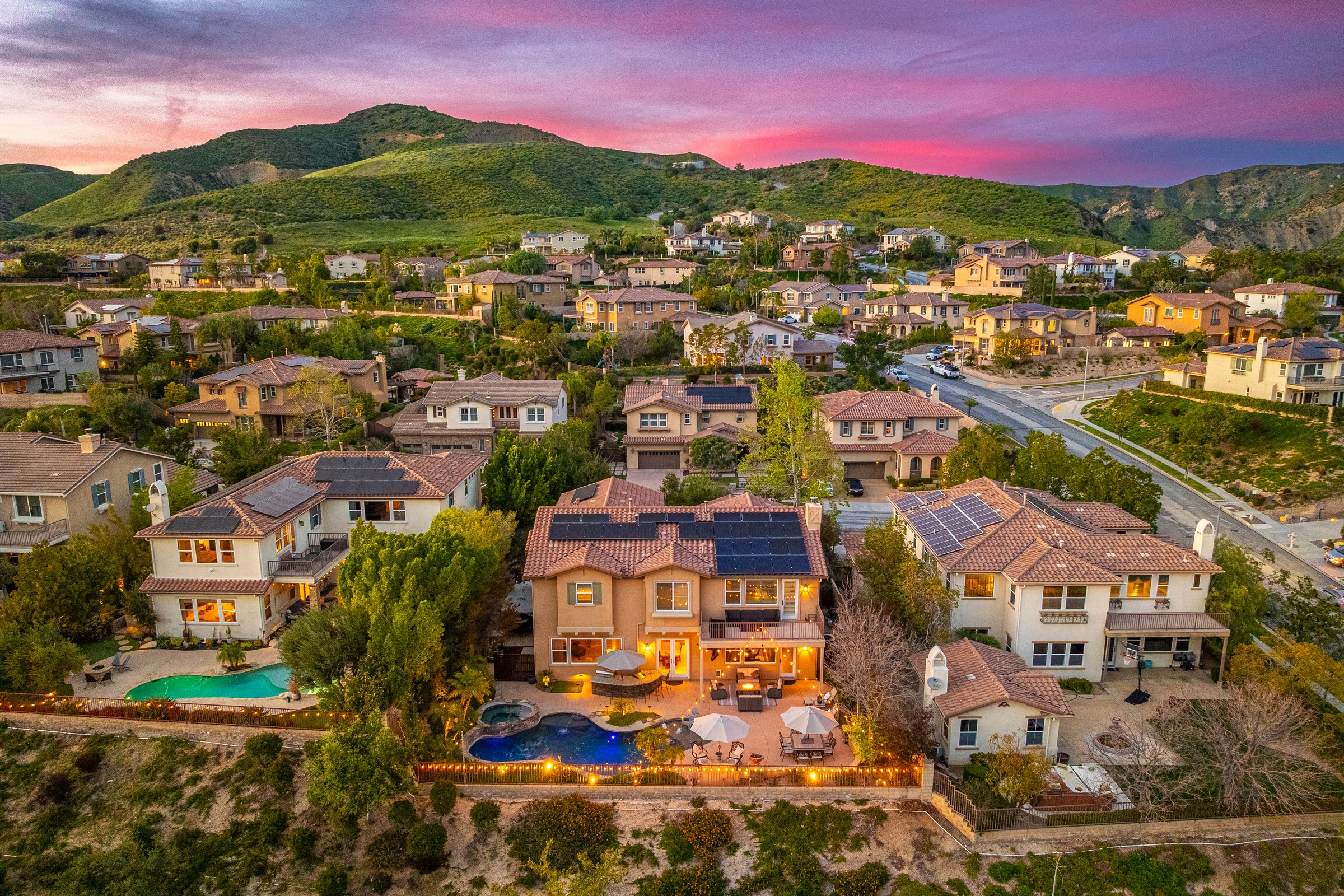 Twilight aerial of the property at sunset
